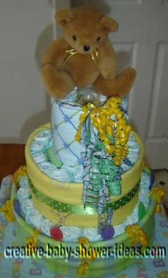 yellow and green bear diaper cake