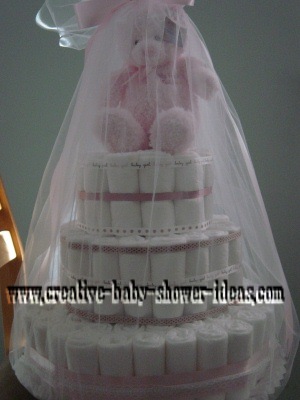 pink and chocolate brown bear diaper cake