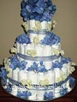 3 tier diaper cake with blue and cream flowers