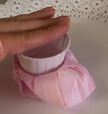 place nut cup inside of baby bootie