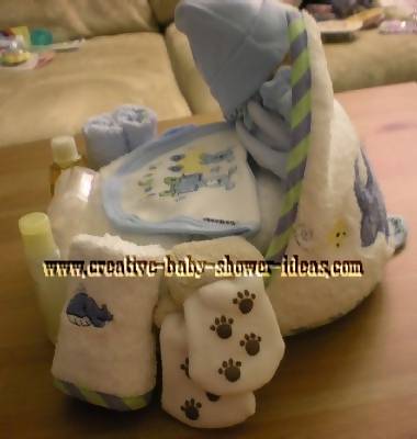 side of towel cupcake showing baby clothing