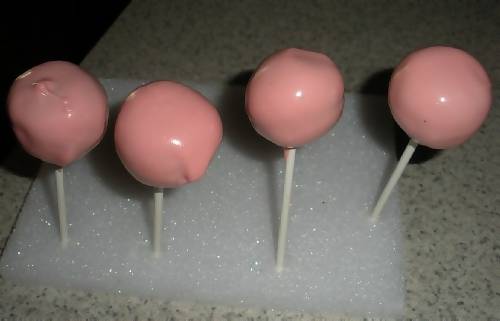 pink cake lollipops drying