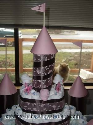 top of princess castle diaper cake with brown and pink towers