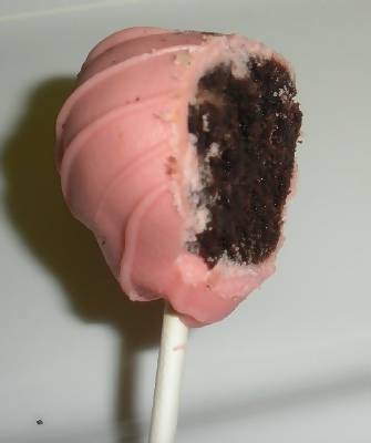 the inside of a pink and chocolate cake lollipop