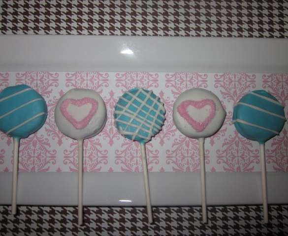 pink heart and blue plaid chocolate covered oreo lollipops