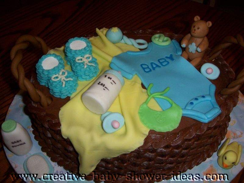 chocolate basket baby shower cake with baby clothes