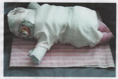 diaper baby sleeping on blanket