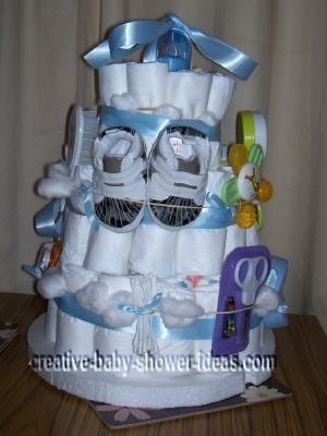 side of boy diaper cake with baby sneakers