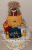 football sports diaper cake with bright boy onesies and tan teddy bear