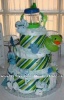 3 tier diaper cake with green and blue stripes and green rubber ducky
