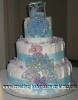 diaper cake with blue ribbon and baby carriage ontop