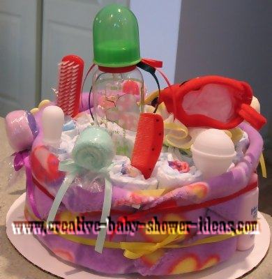 back of lady bug diaper cake with baby supplies