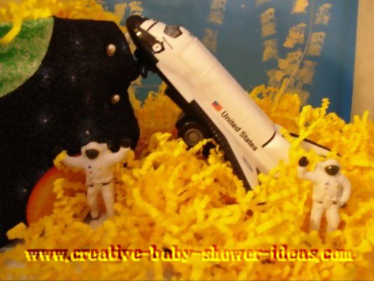 closeup of astronaut and spacecraft on diaper cake decoration