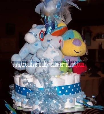 closeup of stuffed animals on top layer of diaper cake