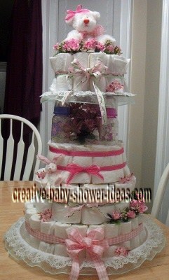 pink and white baby bottle diaper cake