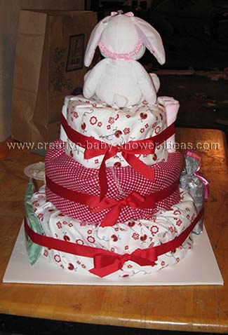 back of red and white bunny diaper cake with ribbon