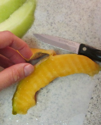 cut skin off back of cantaloupe