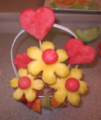 placing skewers into fruit bouquet