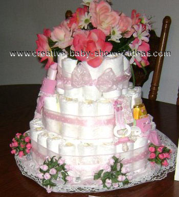 pink and white flowers diaper cake