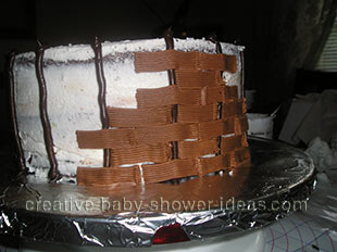 creating the frosting basket weave for the baby cake