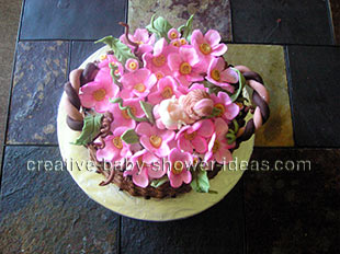 top view of basket baby cake with sleeping baby