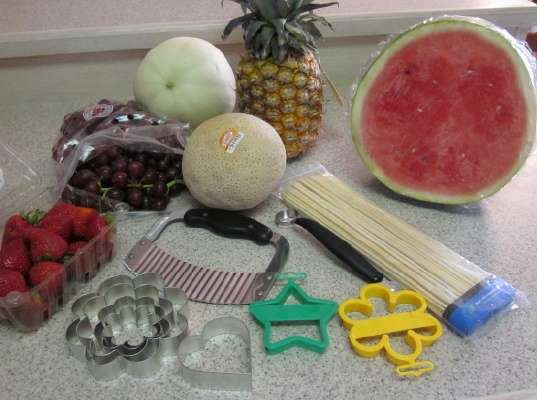 fruit and supplies to make edible bouquet