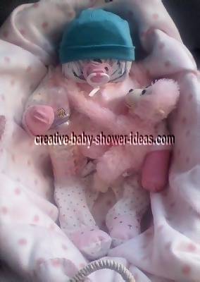 pink and white girl diaper baby with teal hat