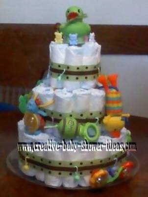  3 tier green and brown polka dot diaper cake with duck on top