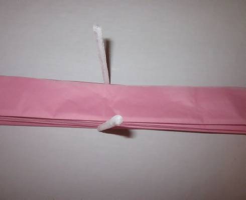 white pipe cleaner around tissue papers