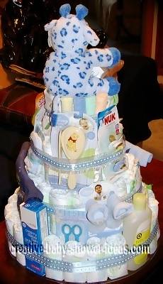 back of giraffe diaper cake showing baby supplies