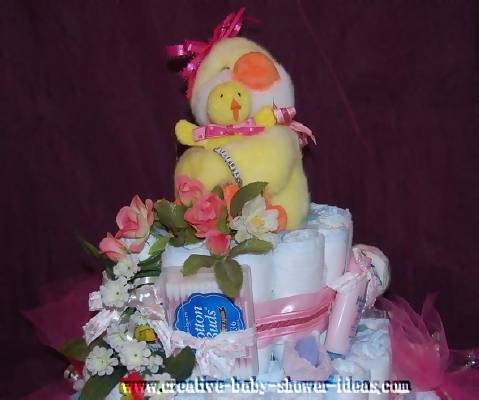 closeup of top of mommy and baby duck diaper cake