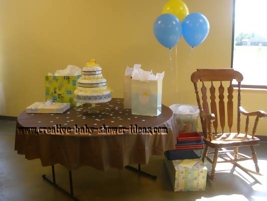 mod duck diaper cake on baby shower gift table