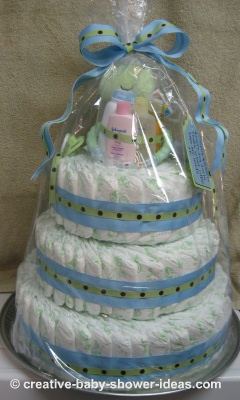 finised frog diaper cake wrapped in cellophane