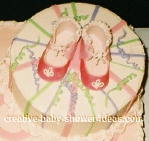 close up of baby shoes on mod mom cake