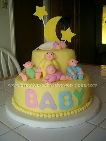 2 tier yellow fondant cake with moon star and baby designs