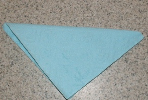 fold napkins in half for nut cups