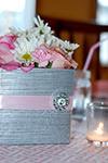 closeup of table decorations at a baby sprinkle party pink and grey modern colors