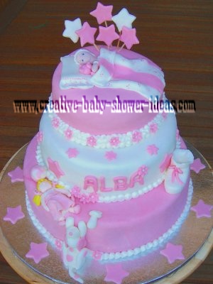 pink stars and flower sleeping baby shower cake