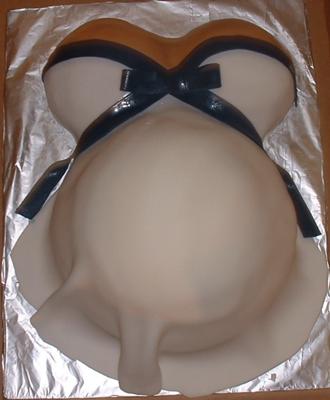 white pregnant belly dress with navy bow baby shower cake