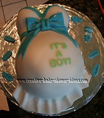 blue and white its a boy baby shower pregnant belly cake