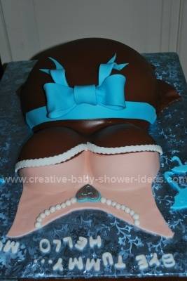 pregnant belly cake from the front showing necklace details