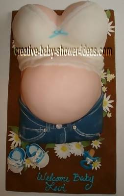 baby shower pregnant belly cake that says welcome baby levi