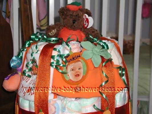 closeup of baby picture on lil pumpkin diaper cake