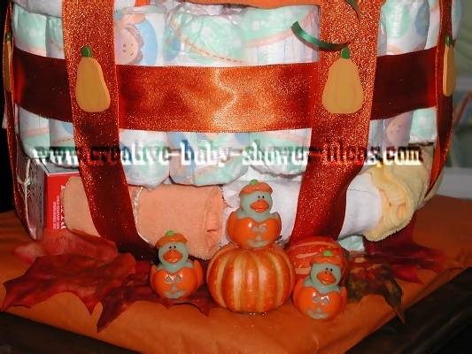 closeup of orange sparkly ribbon on pumpkin diaper cake