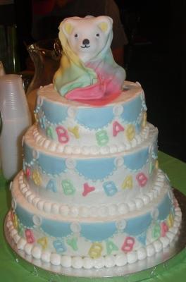 teddy and pink blue and yellow blanket cake