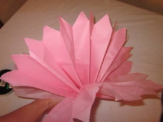 pull on end of tissue paper pom poms out