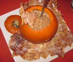 caramel toffee dip in pumpkin with bat chips