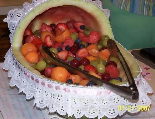 watermelon baby carriage with white and pink lace ribbon