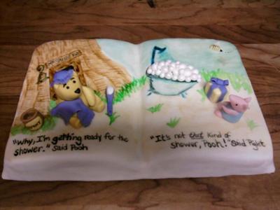 closeup of winnie the pooh cake showing baby shower details