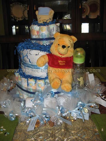 blue winnie the pooh diaper cake with paper shred